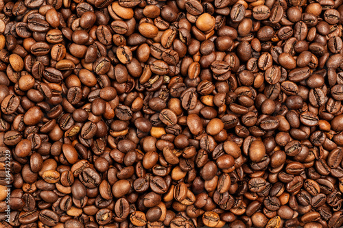 Background coffee beans. Pattern of brown roasted coffee bean beans © simikov