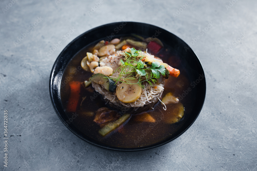 plant-based food, vegan noodles soup with mixed stir fry vegetables plant-based food, vegan noodles soup with mixed stir fry vegetables