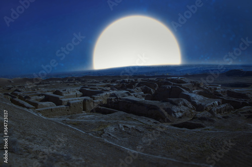 full moon over the ruins  of an ancient Parthian fortress in the desert at night