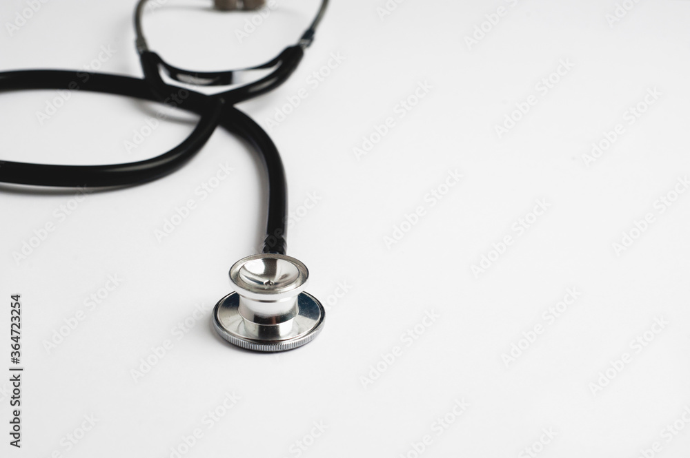 stethoscope partial view with white background, text space stethoscope partial view with white background, text space