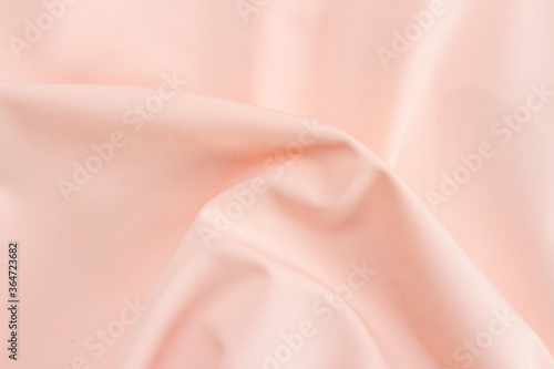 Texture of the silk fabric of pink color for the background © epovdima