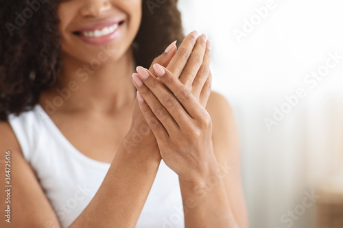 Skincare For Hands. Unrecognizable Black Woman Enjoying Her Soft Moisturized Skin