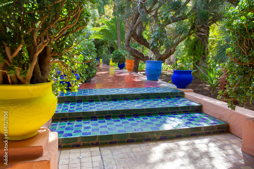 Amazing alley in Majorelle garden with famous moroccan tiles photo
