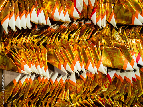 Canvas Print Gold Chinese joss paper folded into the shape of a gold ingot for ancestral wors