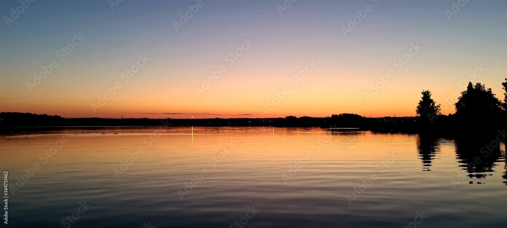 Obraz premium sunset over the river