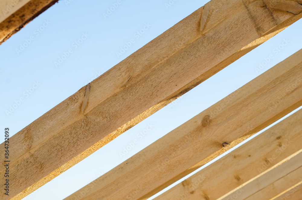 wooden bars against the sky. roof construction