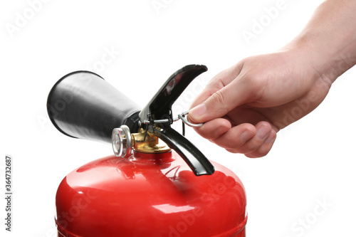 Man using fire extinguisher on white background, closeup photo