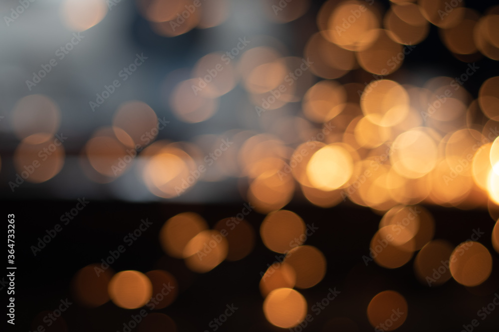 Fototapeta premium Gold abstract bokeh background, Festive xmas abstract background with bokeh defocused lights and stars
