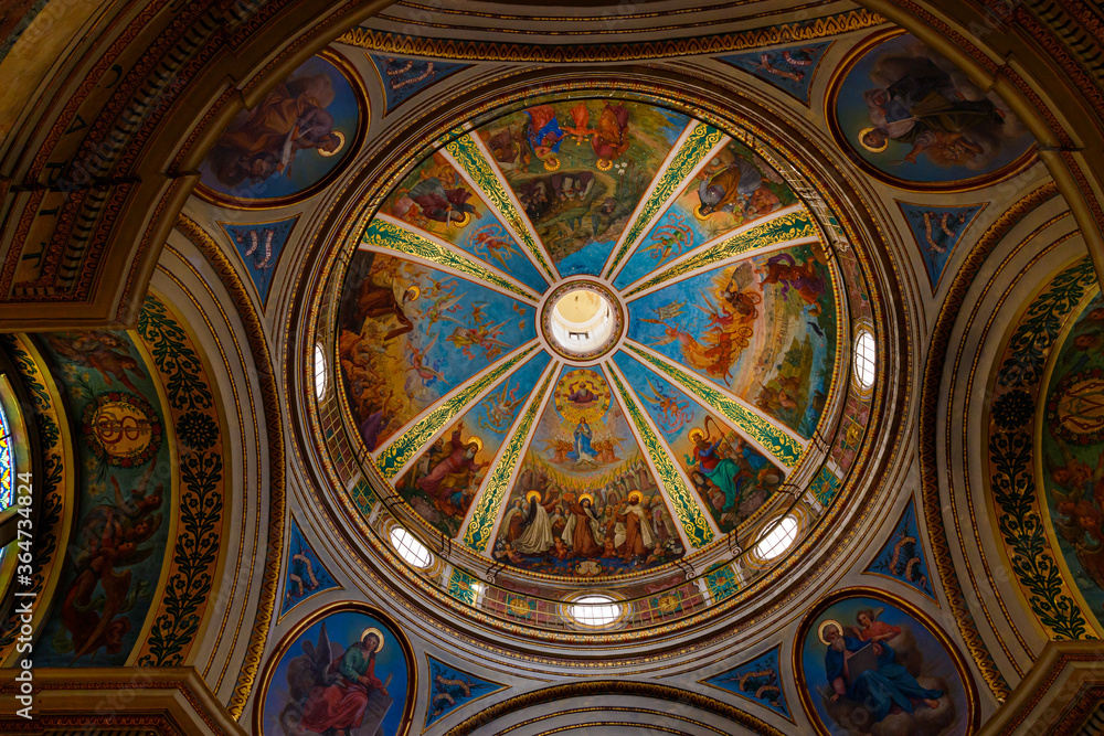 Obraz premium The decoratively painted dome in the main hall of the Stella Maris Monastery which is located on Mount Carmel in Haifa city in northern Israel