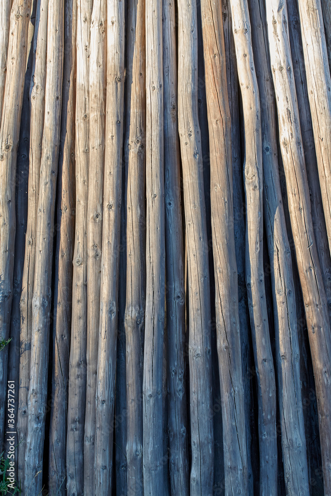 old dilapidated gray wooden posts, gray wood texture