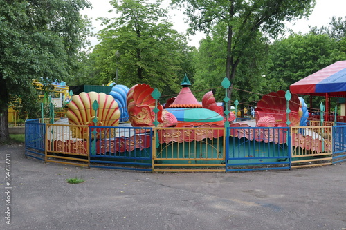 kids carousels in belarusian city park photo