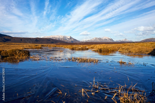 Iceland blue ice cold volcanic hills landscape mountain panorama summer scenic beautiful islandic nature outdoor scenery yellow grass view. Europe wilderness nordic adventure