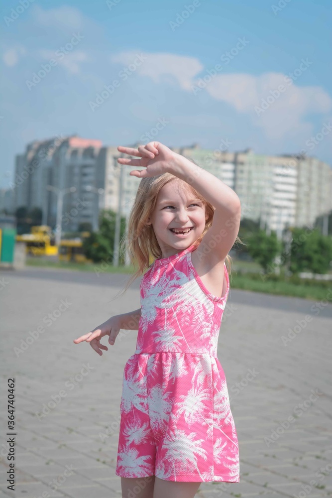 girl of five years having fun in the city after quarantine
