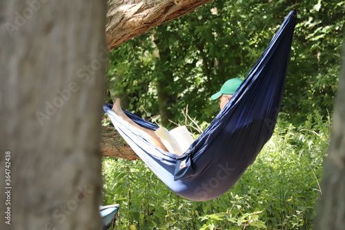 woman relaxing in hammock
