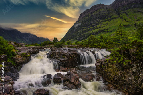 Waterfalls at sunrise in Glencoe, highlands, Scotland.