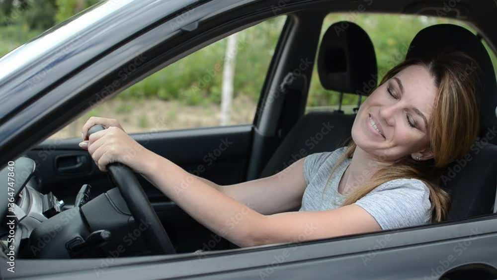Young charming girl driving a car Young charming girl driving a car