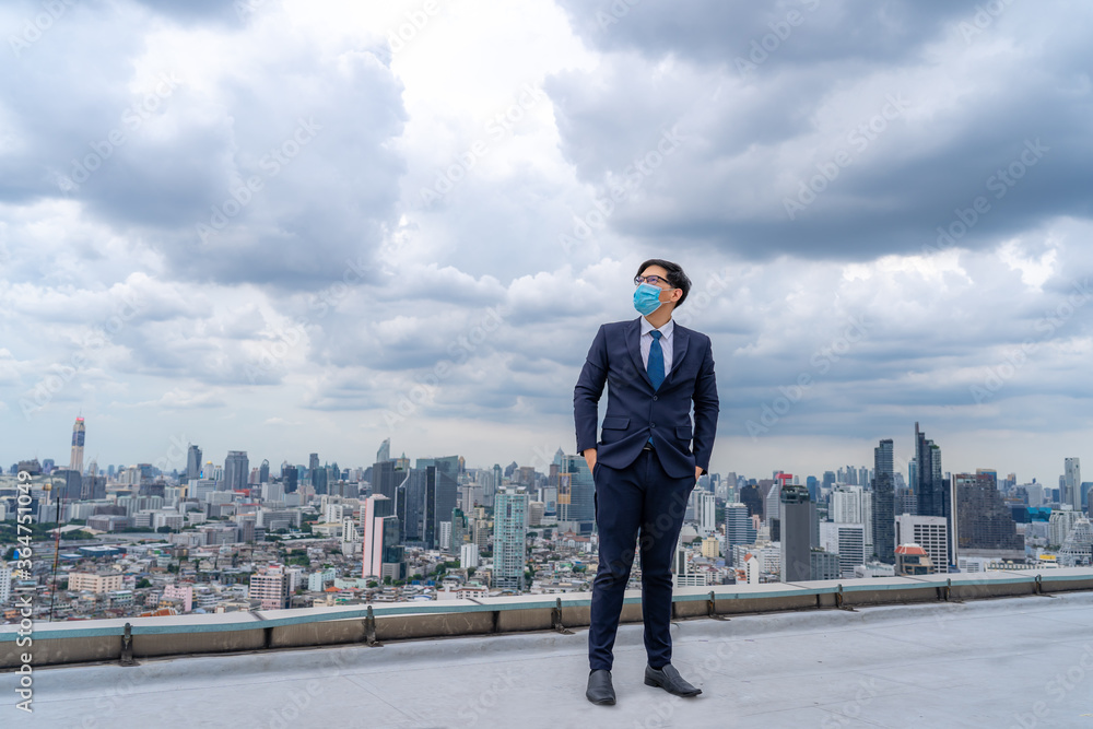 Young businessman wear masks to prevent dust and toxic pollution from the air, smoke and viral diseases,Perspectives on the future and success Young businessman wear masks to prevent dust and toxic pollution from the air, smoke and viral diseases,Perspectives on the future and success