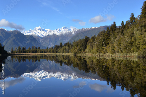 Lake Matheson, near the Fox Glacier in South Westland, New Zealand, is famous for its reflected views of Aoraki/Mount Cook and Mount Tasman.