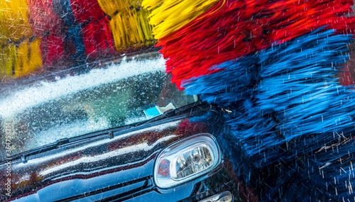 Car going through an automated car wash machine