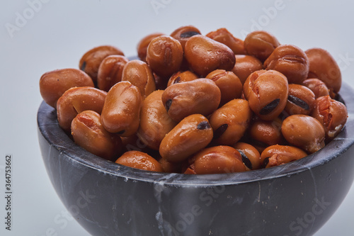 Fava beans (foul) shot on white background.