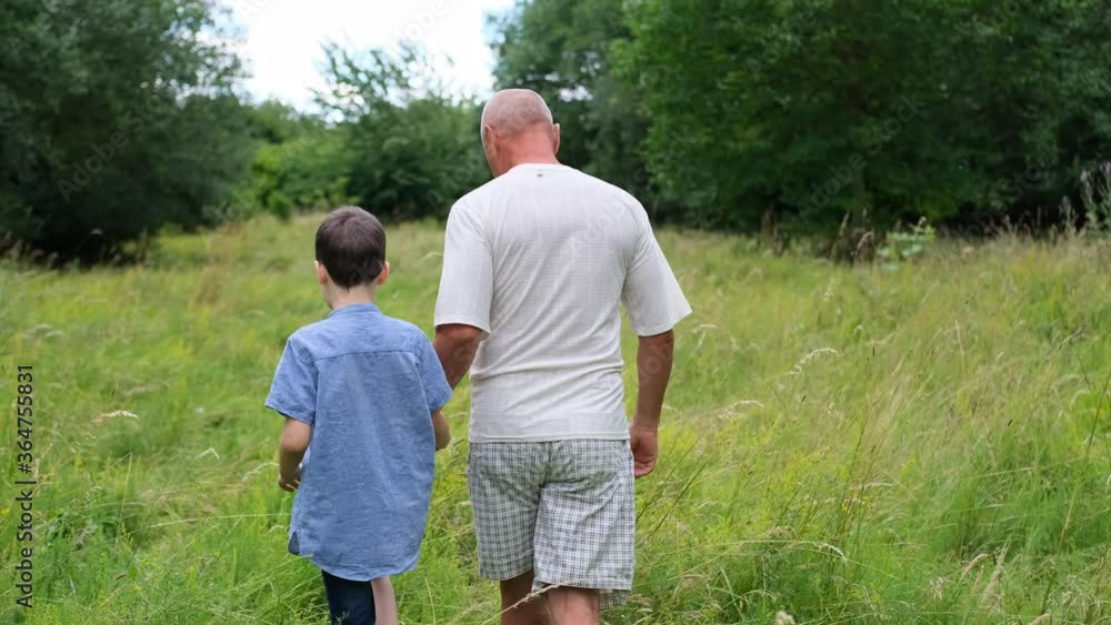 family, man and children walk among meadows and forests in summer, the concept of family summer vacations, picnics, vacations, camping, activity in the park