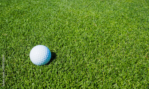 Golf balls on the green lawn, outdoor on the field