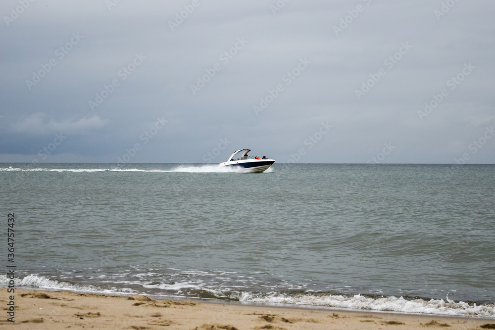 Fototapeta premium White speedboat in the waters of the Baltic Sea