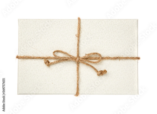 Gift box with burlap ribbon on a white background.