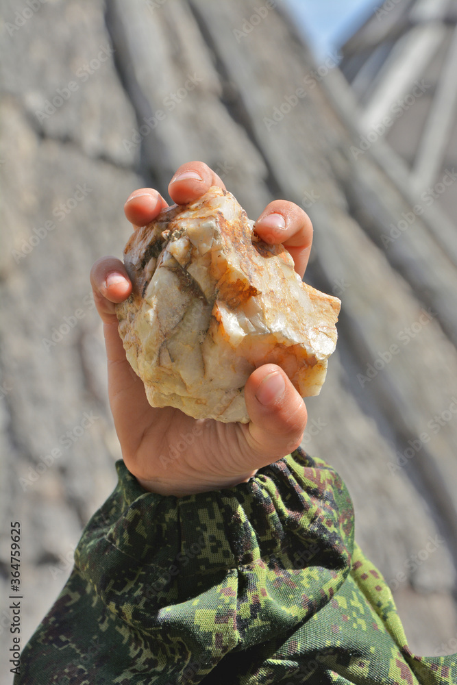 stone in a child's hand