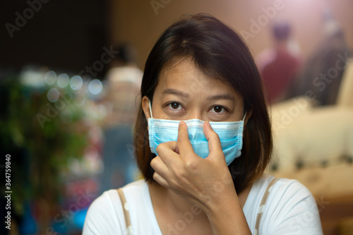Asian woman wearing protective mask on her face