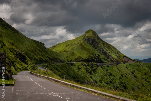 mountain road or  pass , pas de peyrol ,auvergne, cantal France , landcape , with cloudy sky ,walking ,adventure holiday.