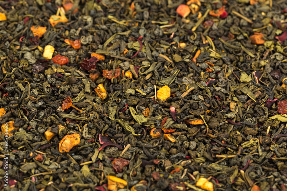 Leaves of Chinese Dry Tea Top Grade with Goji Berries and Powdered Acai on White Background Leaves of Chinese Dry Tea Top Grade with Goji Berries and Powdered Acai on White Background