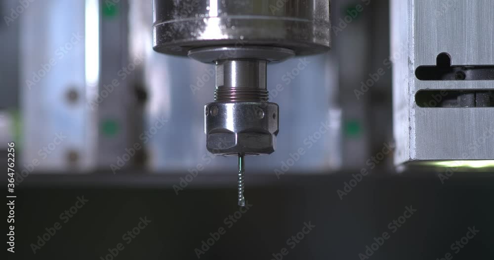 Close-up drill for milling installation, CNC. Drill starts to rotate, the beginning of the work of the factory equipment. Close-up drill for milling installation, CNC. Drill starts to rotate, the beginning of the work of the factory equipment.
