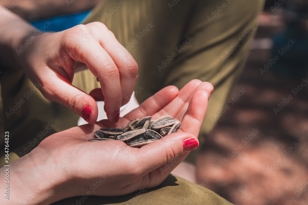 Fototapeta premium The lady in green pants with a core in her palm. core fencing