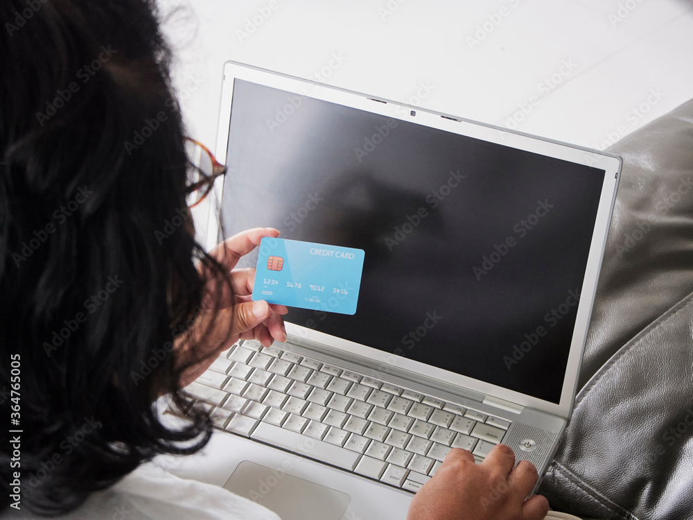 Woman shopping online at home Woman shopping online at home