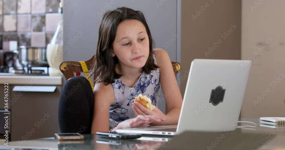 MS Girl (10-11) using laptop at table at home / Florence, Tuscany, Italy MS Girl (10-11) using laptop at table at home / Florence, Tuscany, Italy