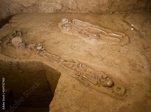 Ban Kao Neolithic burial site in Kanchanaburi, Thailand displays skeletons pots and axes