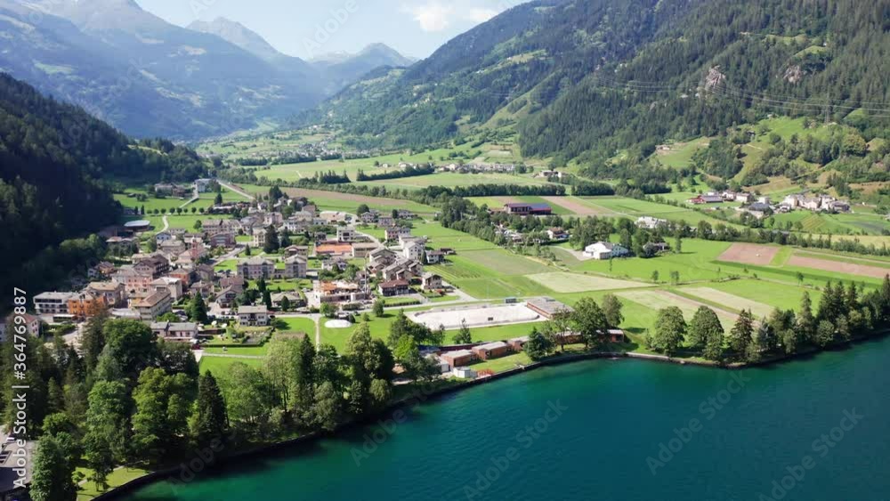 Aerial 4K - Poschiavo valley, Switzerland, view of the village Le Prese from the Poschiavo lake Aerial 4K - Poschiavo valley, Switzerland, view of the village Le Prese from the Poschiavo lake