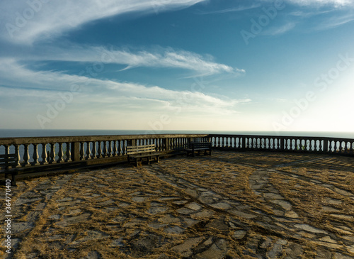 Lookout point with stone floor and soft hazy clouds