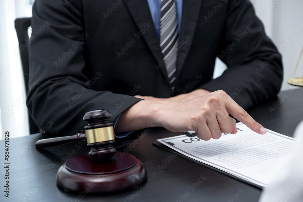 The male lawyer is providing service to consult business dispute to businessman The male lawyer is providing service to consult business dispute to businessman