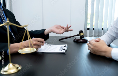 The male lawyer is providing service to consult business dispute to businessman