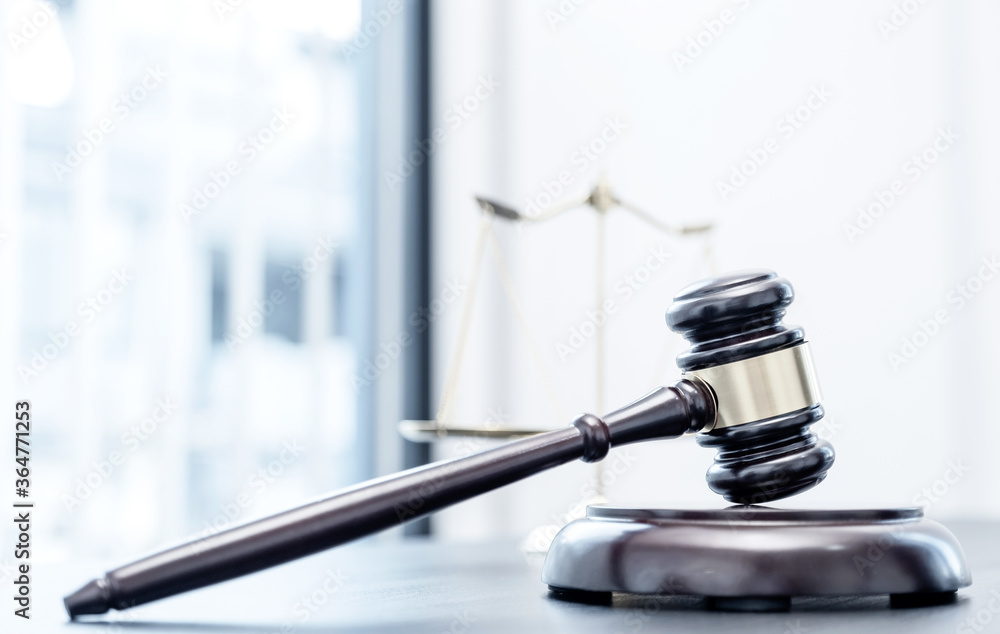 Judge gavel, scales of justice on the office desk, the white background office of a lawyer or judge Judge gavel, scales of justice on the office desk, the white background office of a lawyer or judge