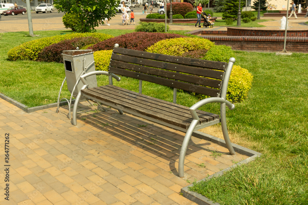 Simple shot of the wooden bench at the park. Rest concept. 