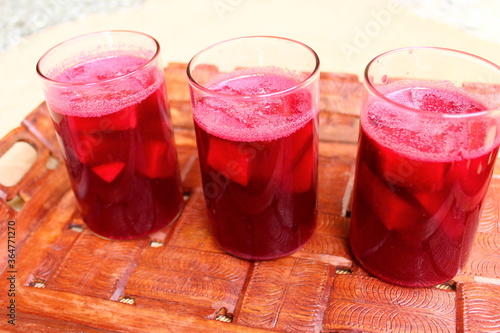Glasses filled with Carrot Kanji, an Indian probiotic fermented drink