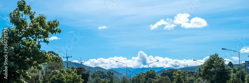 Beautiful landscape white clouds blue sky mountain in the countryside © Lucky7Trader