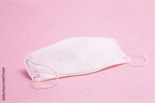 Medical protective mask isolated on pink background