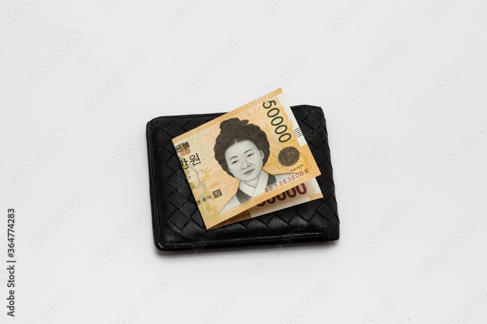 Paper korea won banknotes in old leather purse Paper korea won banknotes in old leather purse
