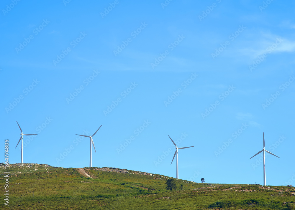 mountains with windmills and blue sky mountains with windmills and blue sky