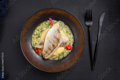 Steamed hot fish dish pike perch with Polish sauce