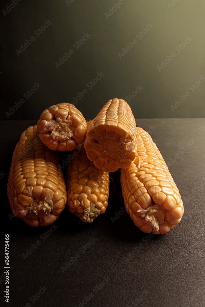 Sweet fresh corn on black background Sweet fresh corn on black background